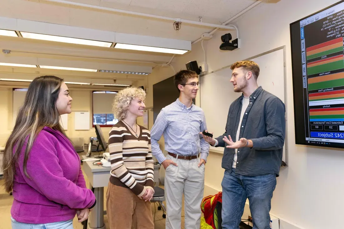 School of Education students standing and talking together.